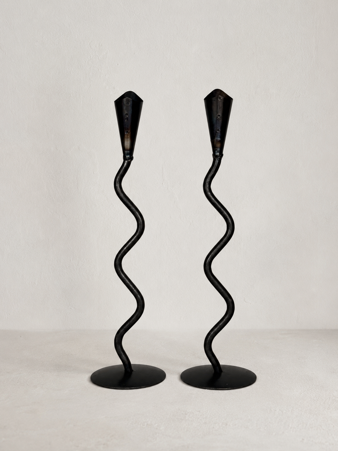 Pair of Hand Forged Iron Wavy Candlesticks