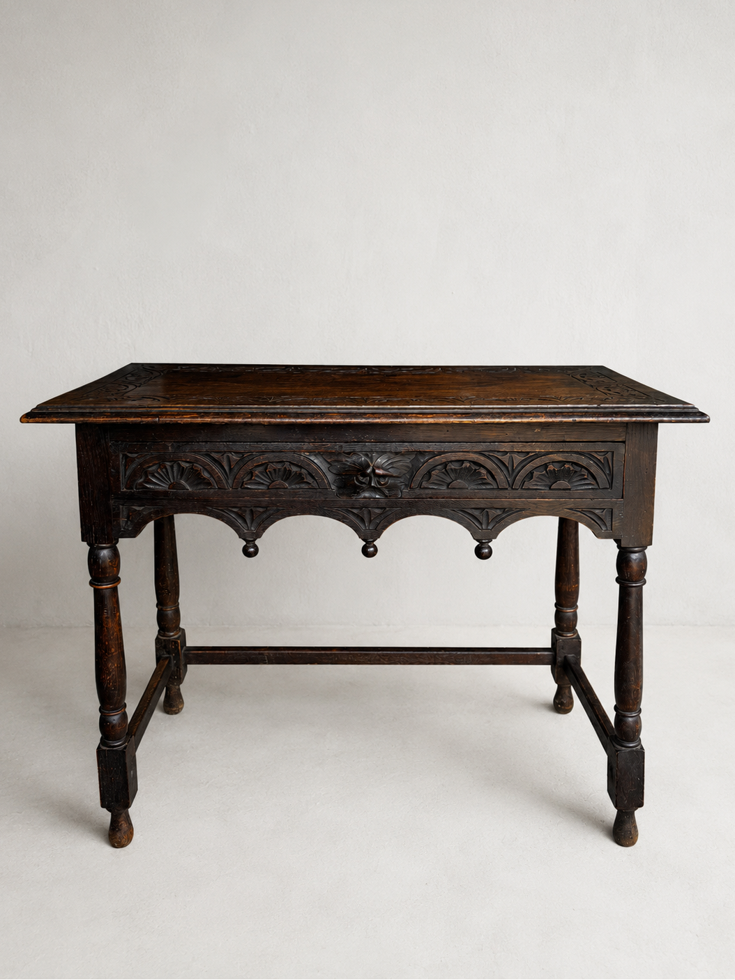 Antique Victorian oak Green Man side table with Gothic Revival carving and turned legs