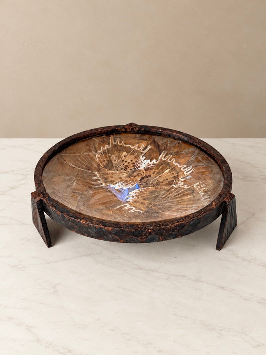 Antique French vide-poche by Les Papillons de Péguy, featuring real butterfly wings preserved beneath glass in a circular hammered iron tray with three angular feet.