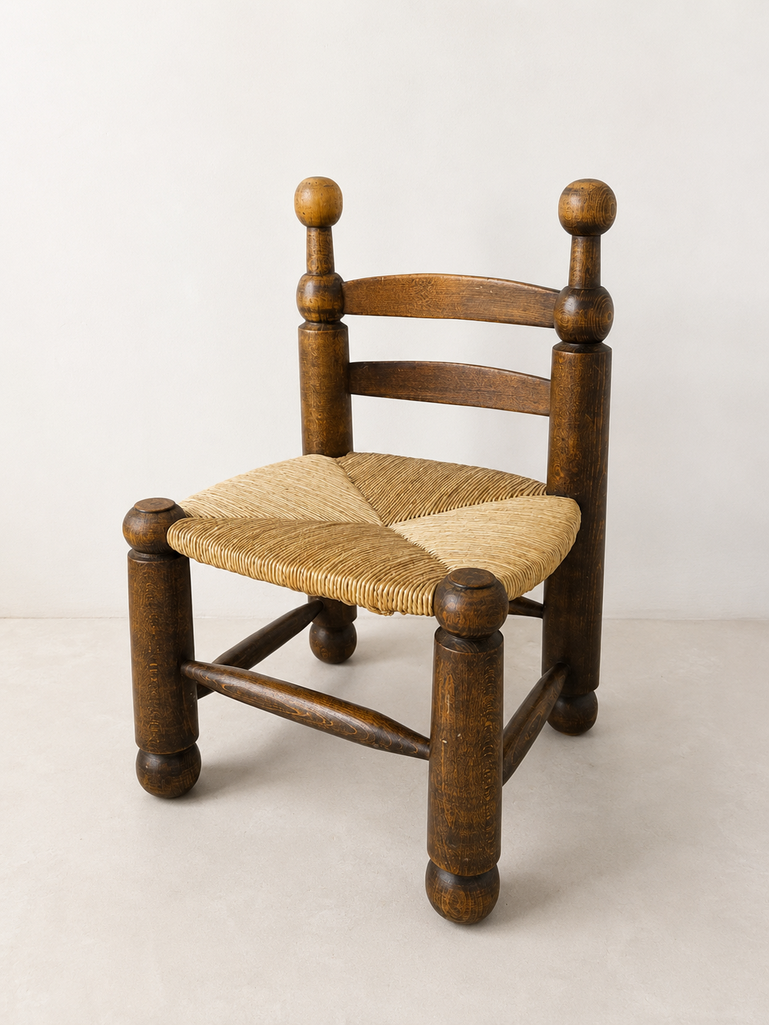 Early 20th century Charles Dudouyt oak corner chair with rush seat