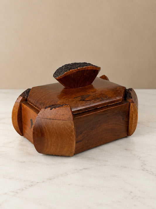 French Art Deco wooden lidded box marked PEHEM Déposé, featuring curved sculptural corners, dark carved details and a removable rectangular lid.