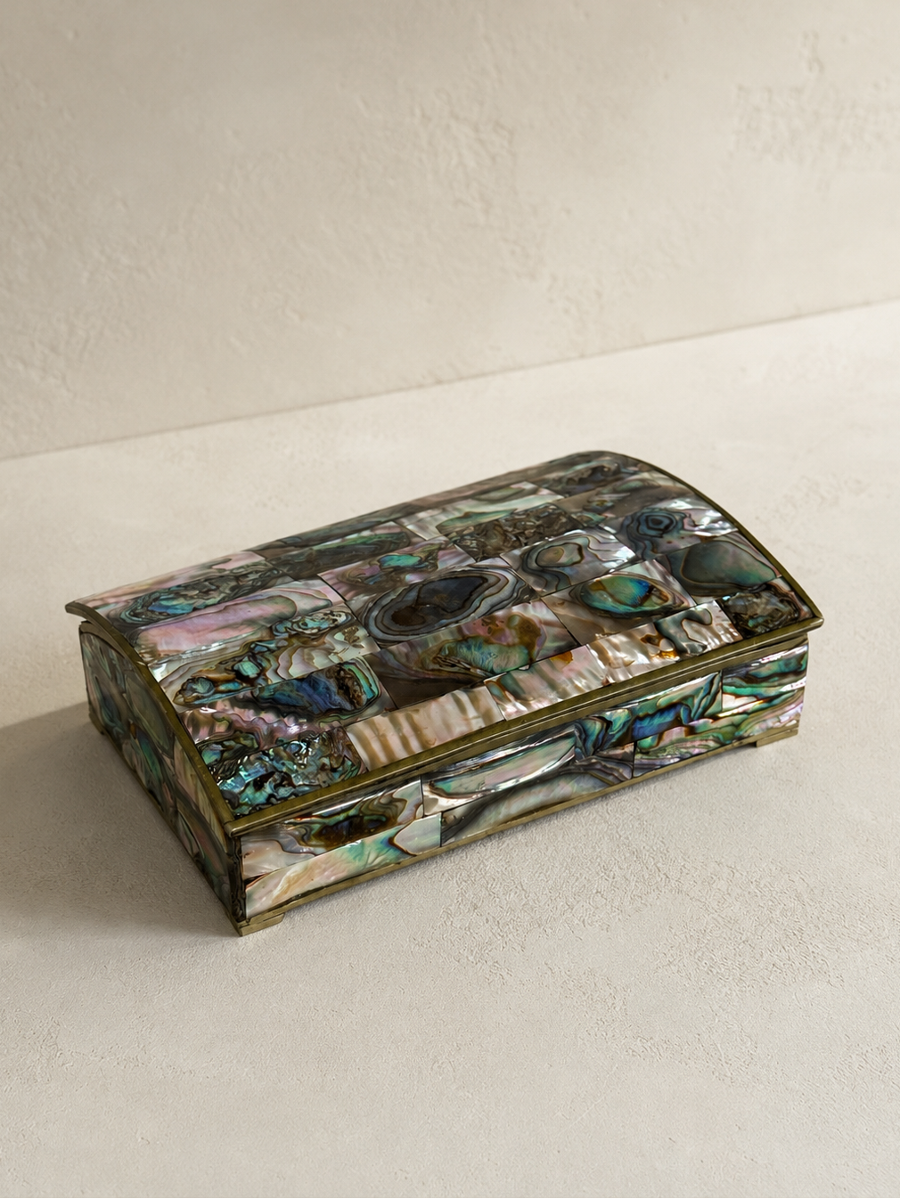 Alpaca silver lidded box with iridescent natural abalone shell panels and curved lid.